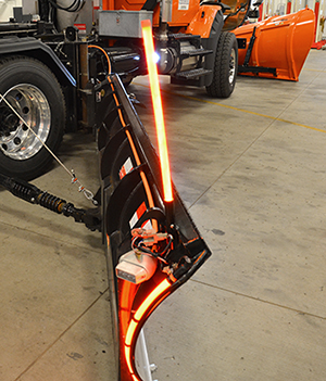 Photo of lighted wing plow.